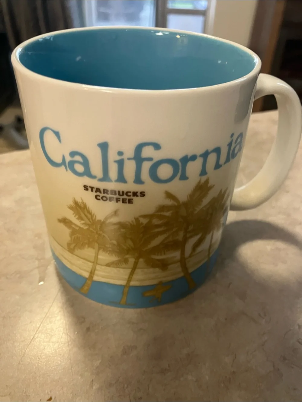 Starbucks White Mug with Green Interior and Green Alaska Lettering